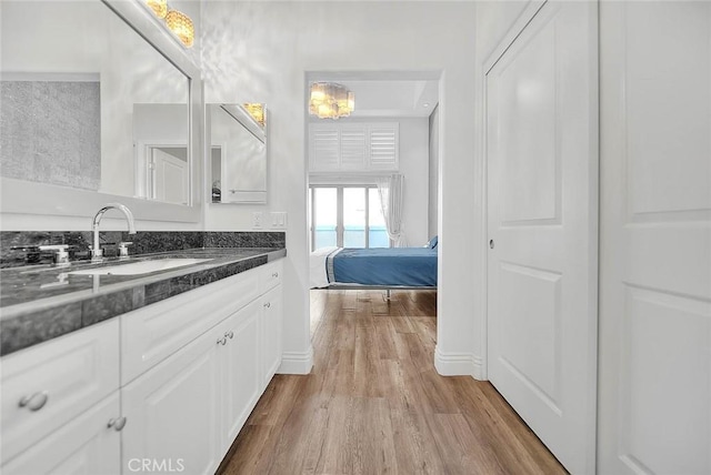 600 N Atlantic Blvd Unit 209, Monterey Park, CA 91754 - bathroom with wood finished floors, baseboards, and vanity