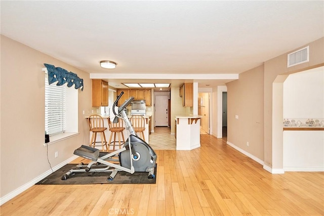 9615 Shadow Springs Dr, Moreno Valley, CA 92557 - exercise room featuring light wood finished floors and baseboards