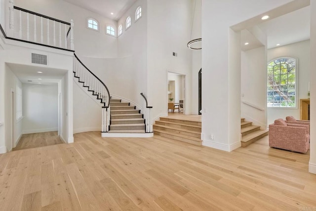 6039 Calle Camposeco, Rancho Santa Fe, CA 92067 - foyer featuring stairway, wood finished floors, baseboards, recessed lighting, and a high ceiling