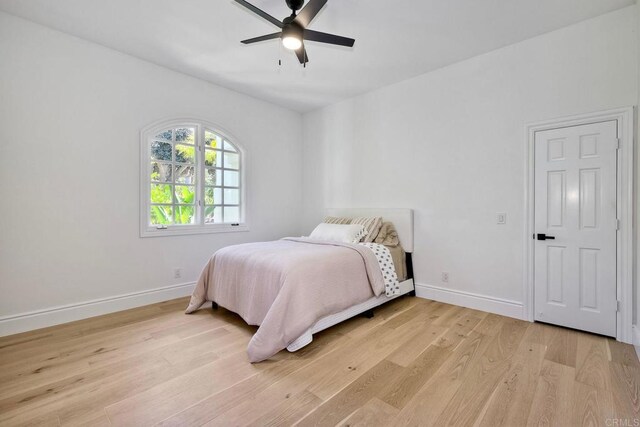6039 Calle Camposeco, Rancho Santa Fe, CA 92067 - bedroom featuring light wood-style flooring, baseboards, and a ceiling fan