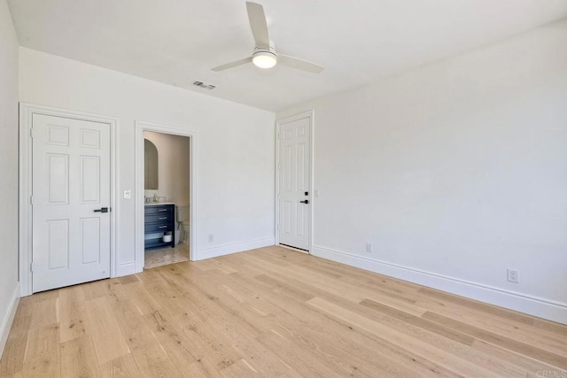 6039 Calle Camposeco, Rancho Santa Fe, CA 92067 - unfurnished bedroom featuring light wood-style flooring, baseboards, ensuite bathroom, and ceiling fan
