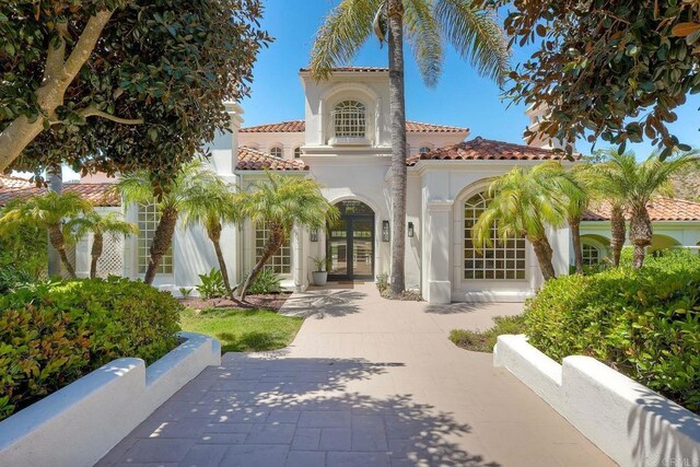 6039 Calle Camposeco, Rancho Santa Fe, CA 92067 - mediterranean / spanish-style home with french doors, stucco siding, and a tile roof