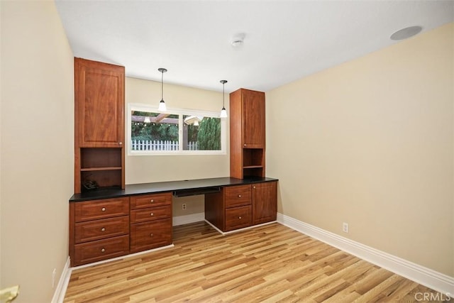 25412 Hugo Rd, Laguna Niguel, CA 92677 - unfurnished office with built in study area and light wood-style floors