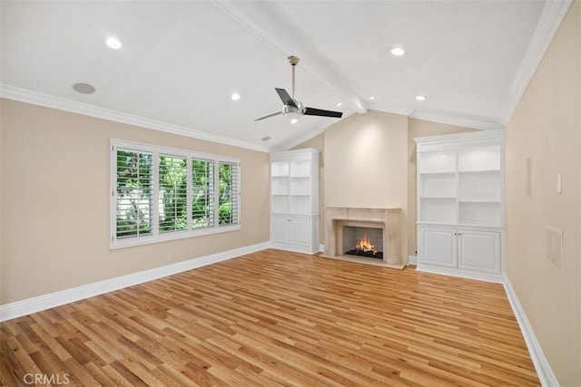25412 Hugo Rd, Laguna Niguel, CA 92677 - unfurnished living room with light wood-style flooring, ceiling fan, crown molding, a lit fireplace, and recessed lighting