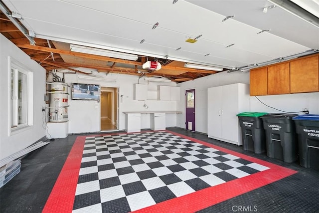 25412 Hugo Rd, Laguna Niguel, CA 92677 - garage with secured water heater and a garage door opener