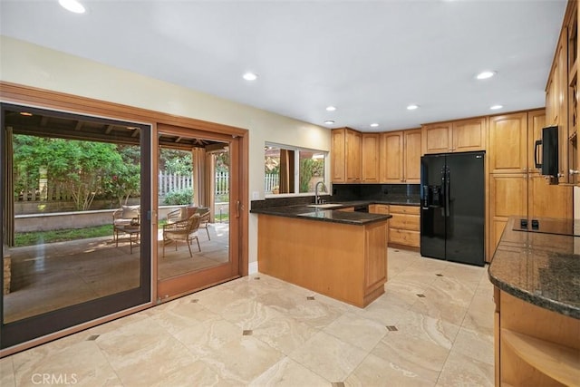 25412 Hugo Rd, Laguna Niguel, CA 92677 - kitchen featuring black appliances, a peninsula, recessed lighting, and dark stone countertops