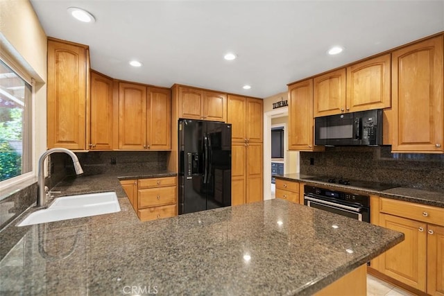 25412 Hugo Rd, Laguna Niguel, CA 92677 - kitchen with black appliances, decorative backsplash, dark stone countertops, recessed lighting, and a peninsula