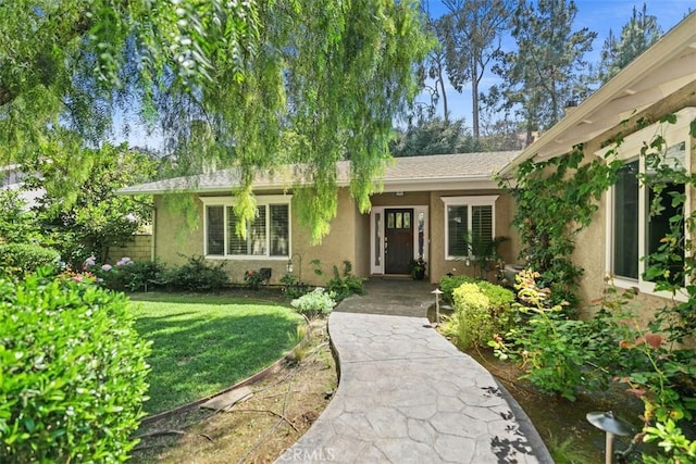 25412 Hugo Rd, Laguna Niguel, CA 92677 - view of front facade featuring stucco siding and a front lawn