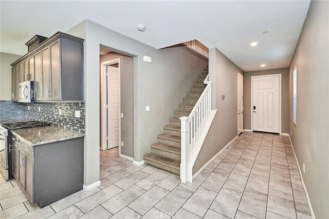 894 Harvest Ave, Upland, CA 91786 - kitchen featuring stainless steel appliances, decorative backsplash, recessed lighting, light stone countertops, and baseboards