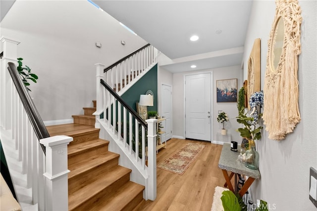36438 Geranium Dr, Lake Elsinore, CA 92532 - foyer with light wood finished floors, recessed lighting, stairs, and baseboards