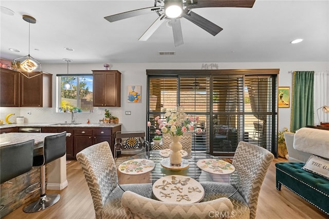 36438 Geranium Dr, Lake Elsinore, CA 92532 - dining room featuring light wood-type flooring, a ceiling fan, and recessed lighting