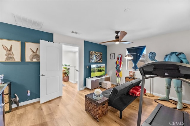 36438 Geranium Dr, Lake Elsinore, CA 92532 - workout area with a ceiling fan, light wood-style flooring, and baseboards