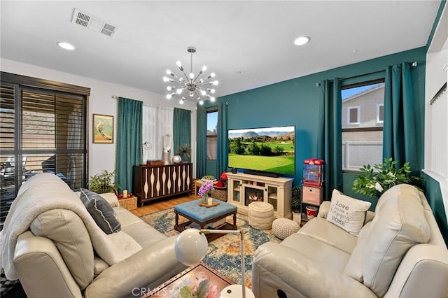36438 Geranium Dr, Lake Elsinore, CA 92532 - living room with a chandelier, wood finished floors, and recessed lighting