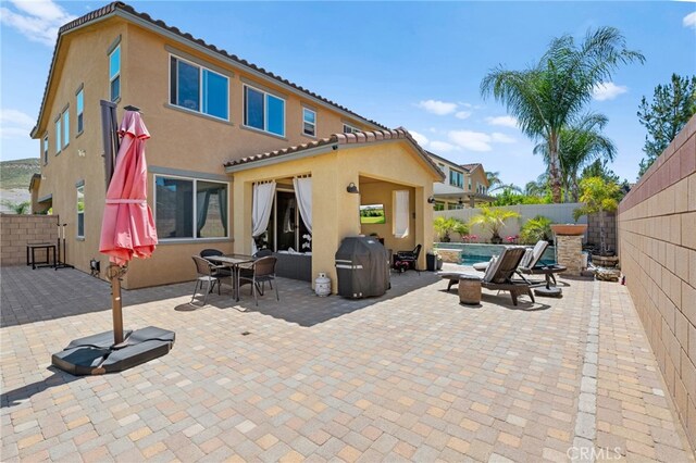 36438 Geranium Dr, Lake Elsinore, CA 92532 - rear view of property with stucco siding, a fenced backyard, and a tiled roof