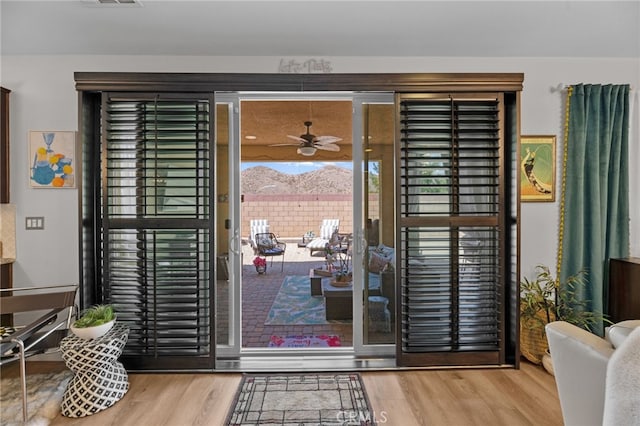 36438 Geranium Dr, Lake Elsinore, CA 92532 - doorway to outside featuring wood finished floors and a ceiling fan