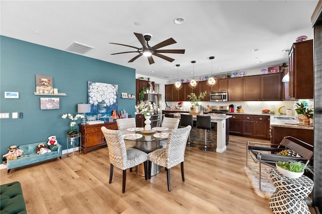 36438 Geranium Dr, Lake Elsinore, CA 92532 - dining room with ceiling fan, light wood-type flooring, and recessed lighting