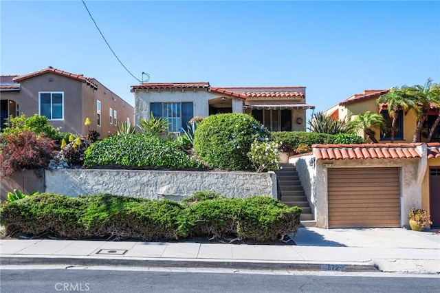 872 W 21st St, San Pedro, CA 90731 - mediterranean / spanish-style home with stairs, stucco siding, concrete driveway, and a tiled roof
