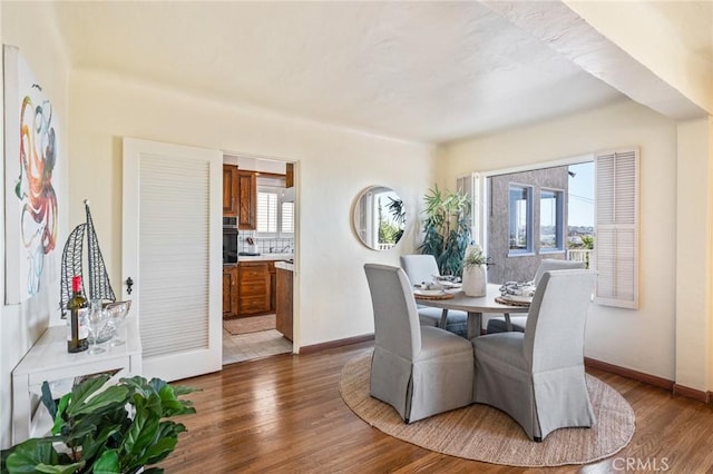 872 W 21st St, San Pedro, CA 90731 - dining area featuring dark wood finished floors and baseboards