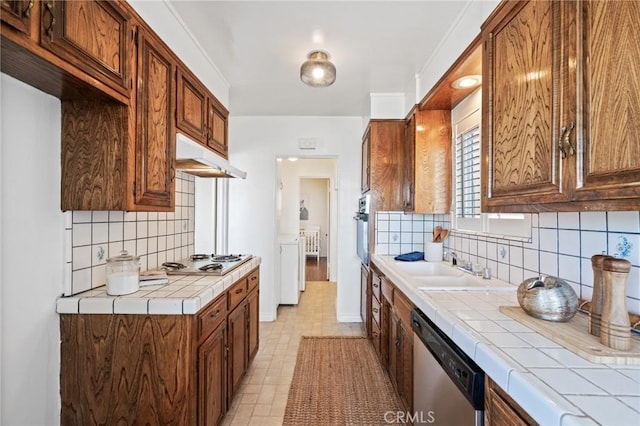 872 W 21st St, San Pedro, CA 90731 - kitchen featuring appliances with stainless steel finishes, tile countertops, under cabinet range hood, tasteful backsplash, and a sink