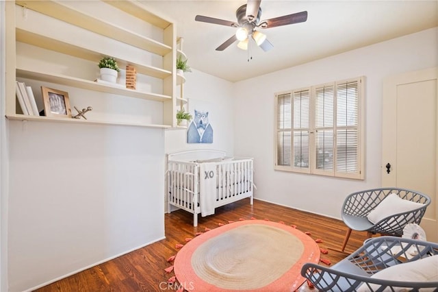 872 W 21st St, San Pedro, CA 90731 - bedroom with wood finished floors, a nursery area, and a ceiling fan