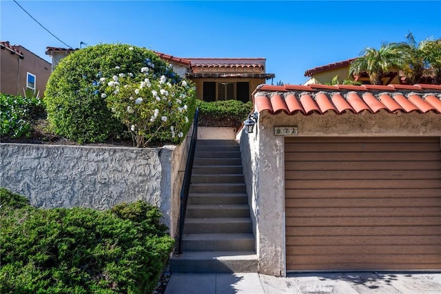 872 W 21st St, San Pedro, CA 90731 - view of front facade with stairs, a tile roof, and stucco siding