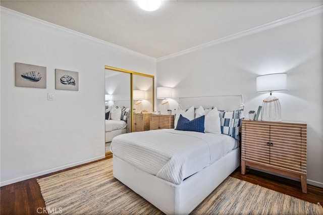 872 W 21st St, San Pedro, CA 90731 - bedroom featuring crown molding, wood finished floors, a closet, and baseboards