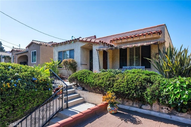 872 W 21st St, San Pedro, CA 90731 - mediterranean / spanish house with a tile roof, stucco siding, and stairway