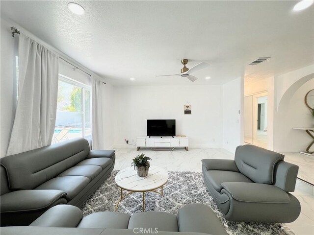 445 E San Rafael Dr, Palm Springs, CA 92262 - living area with marble look tile flooring, baseboards, a ceiling fan, and recessed lighting