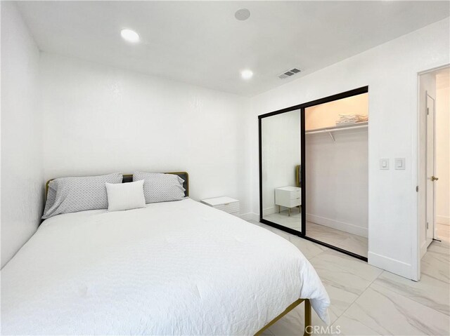 445 E San Rafael Dr, Palm Springs, CA 92262 - bedroom featuring light marble finish flooring, recessed lighting, a closet, and baseboards