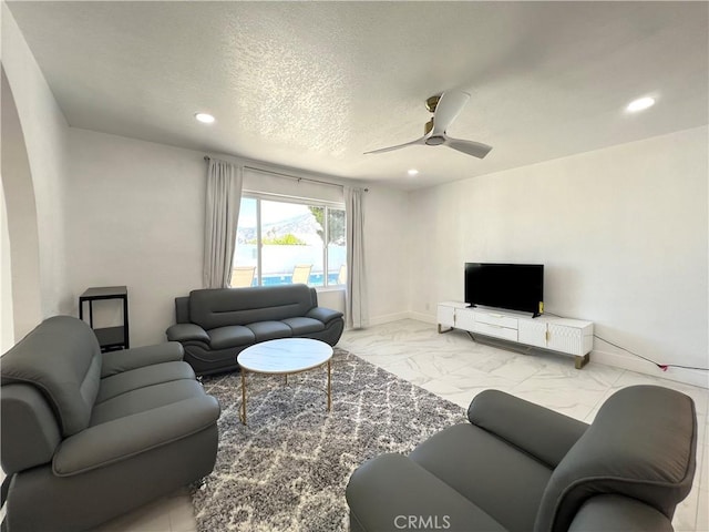445 E San Rafael Dr, Palm Springs, CA 92262 - living room featuring marble finish floors, a ceiling fan, recessed lighting, and a textured ceiling