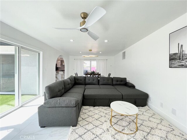 445 E San Rafael Dr, Palm Springs, CA 92262 - living area with arched walkways, ceiling fan, and recessed lighting