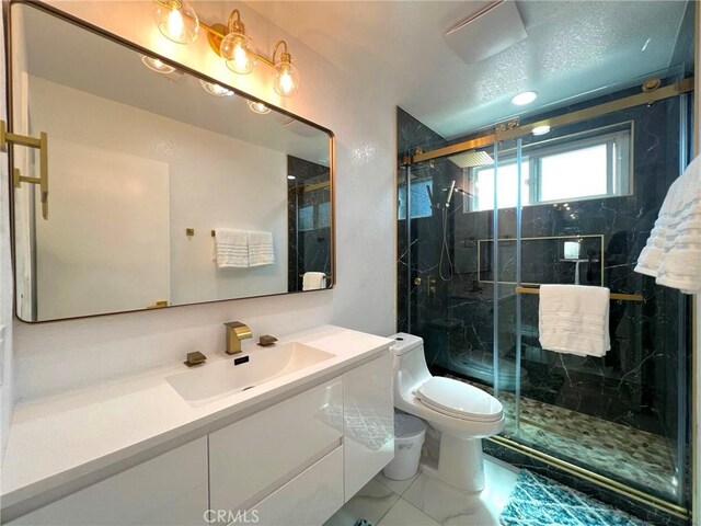 445 E San Rafael Dr, Palm Springs, CA 92262 - full bath with toilet, vanity, and a marble finish shower
