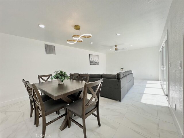 445 E San Rafael Dr, Palm Springs, CA 92262 - dining room featuring light marble finish floors, recessed lighting, a chandelier, and baseboards