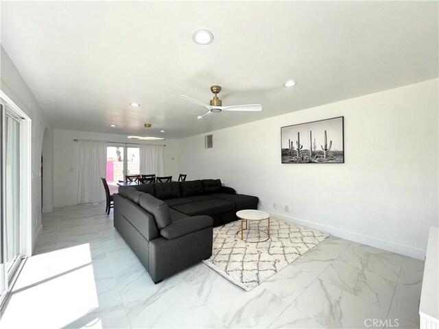 445 E San Rafael Dr, Palm Springs, CA 92262 - living room with light marble finish flooring, recessed lighting, baseboards, and ceiling fan