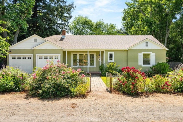 921 Arbutus Ave, Chico, CA 95926 - ranch-style house featuring an attached garage, a chimney, fence, and a shingled roof