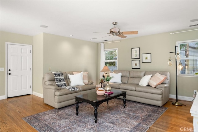 921 Arbutus Ave, Chico, CA 95926 - living area featuring wood finished floors, a ceiling fan, and baseboards