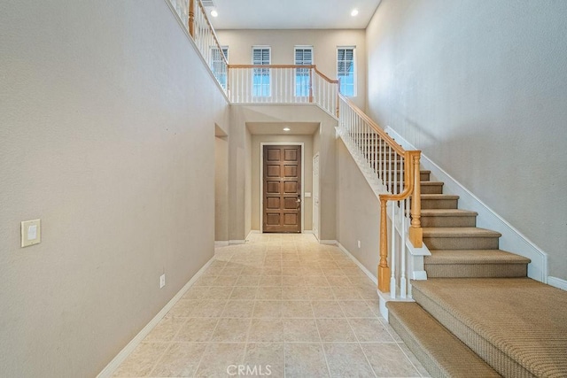 32475 Corte Barela, Temecula, CA 92592 - entryway featuring stairs, recessed lighting, a high ceiling, and baseboards