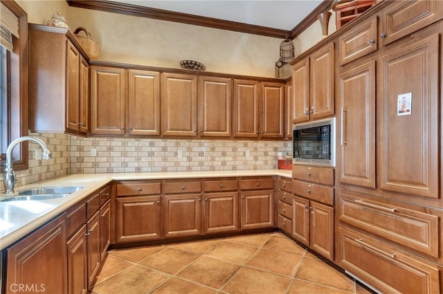 4329 Junction St Unit 103, Corona, CA 92883 - kitchen featuring black microwave, ornamental molding, a sink, light countertops, and light tile patterned flooring