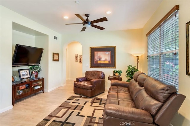 4329 Junction St Unit 103, Corona, CA 92883 - living room with arched walkways, ceiling fan, light wood-type flooring, recessed lighting, and baseboards
