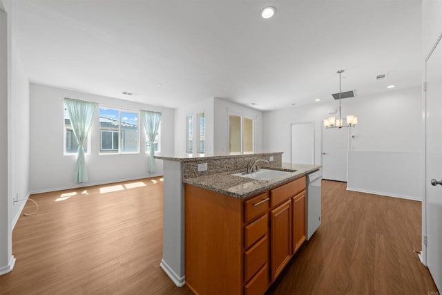 1712 Santa Christina Ave Unit 1, Chula Vista, CA 91913 - kitchen with a sink, brown cabinets, light wood-type flooring, open floor plan, and a chandelier