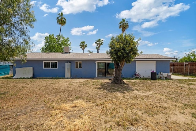 1030 Perrisito St, Perris, CA 92570 - back of property with stucco siding and an attached garage