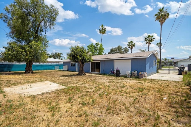 1030 Perrisito St, Perris, CA 92570 - back of property featuring stucco siding and an attached garage