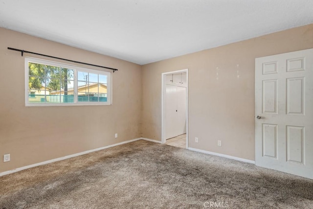 1030 Perrisito St, Perris, CA 92570 - carpeted empty room featuring baseboards