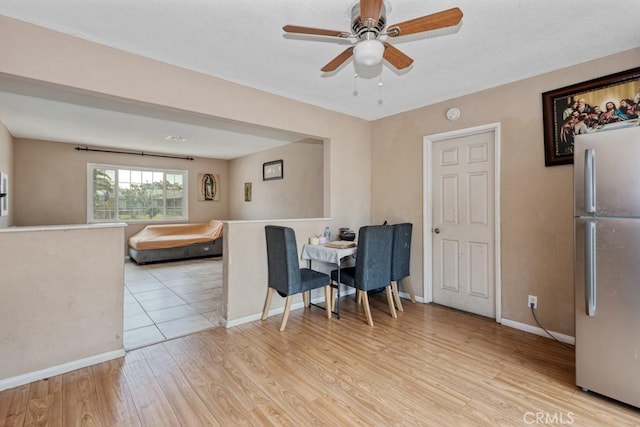 1030 Perrisito St, Perris, CA 92570 - dining room featuring light wood finished floors, a ceiling fan, and baseboards