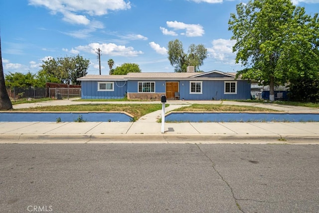1030 Perrisito St, Perris, CA 92570 - single story home with fence and a chimney