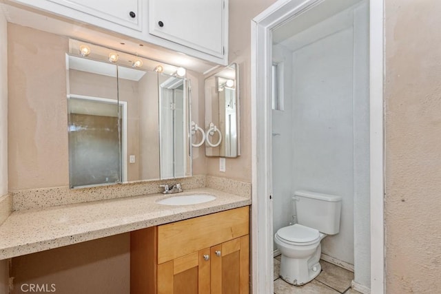 1030 Perrisito St, Perris, CA 92570 - bathroom with toilet, tile patterned floors, and vanity
