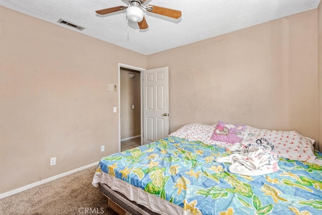 1030 Perrisito St, Perris, CA 92570 - bedroom with baseboards, a ceiling fan, a textured ceiling, and carpet flooring