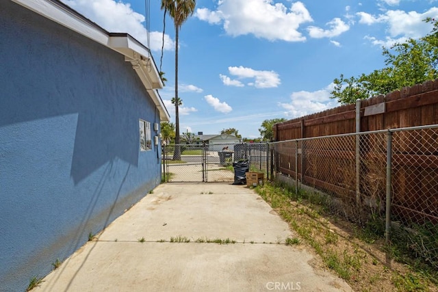 1030 Perrisito St, Perris, CA 92570 - view of concrete surface with a gate and a gated entry