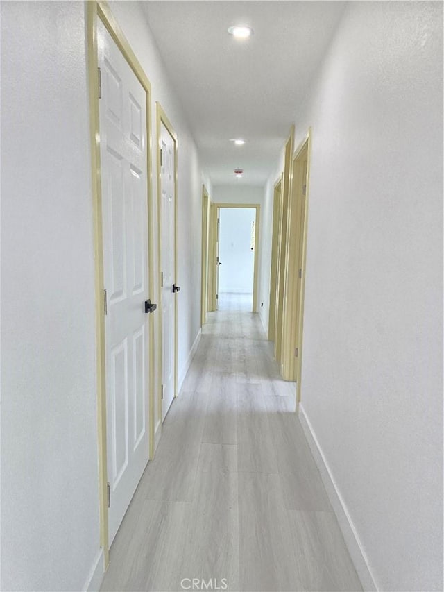 140 E Colden Ave, Los Angeles, CA 90003 - hallway with baseboards and light wood-style floors