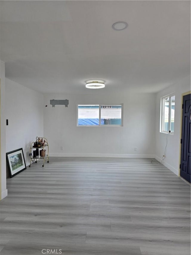 140 E Colden Ave, Los Angeles, CA 90003 - empty room with wood finished floors and baseboards